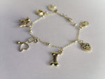 Pulsera dorada charms mascotas huella corazón hueso
