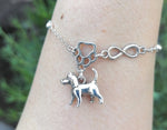 Pulsera infinito patita con dije perrito grande en muñeca